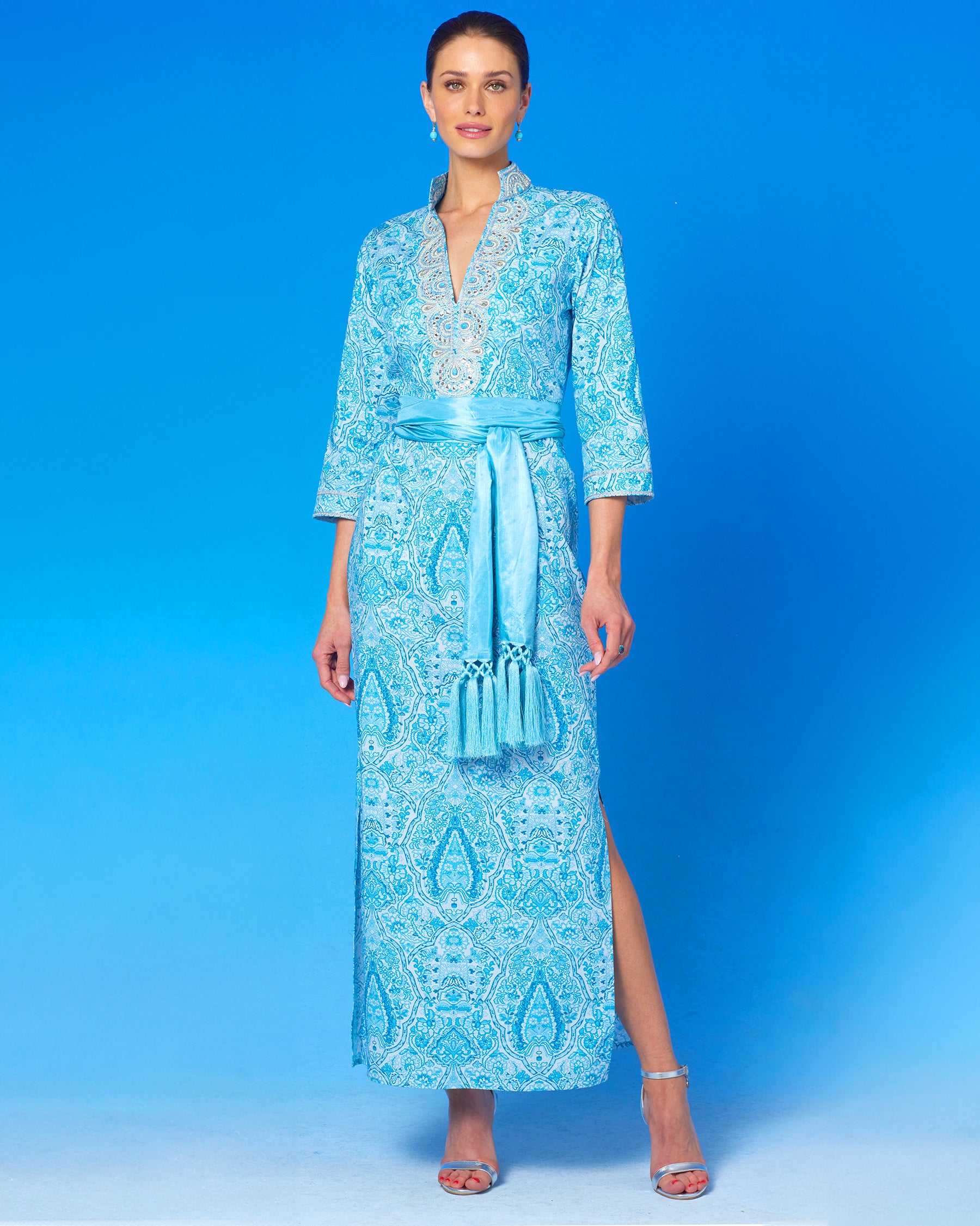 Noor Long Tunic Dress in Turquoise Paisley and Silver Embellishment with waist cinched with the Cosima Turquoise Sash Belt-front view standing