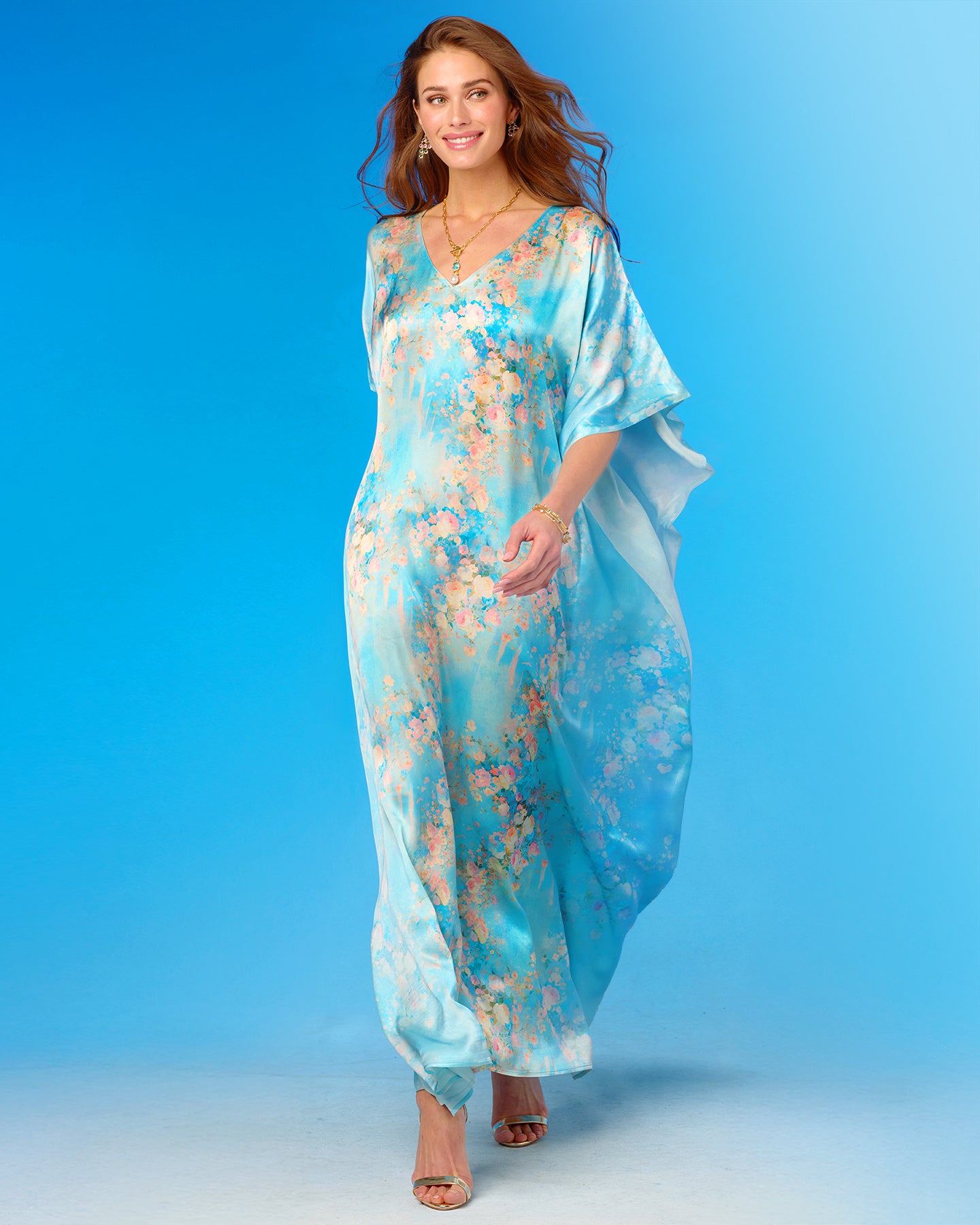 Woman wearing a floral dress against a blue background
