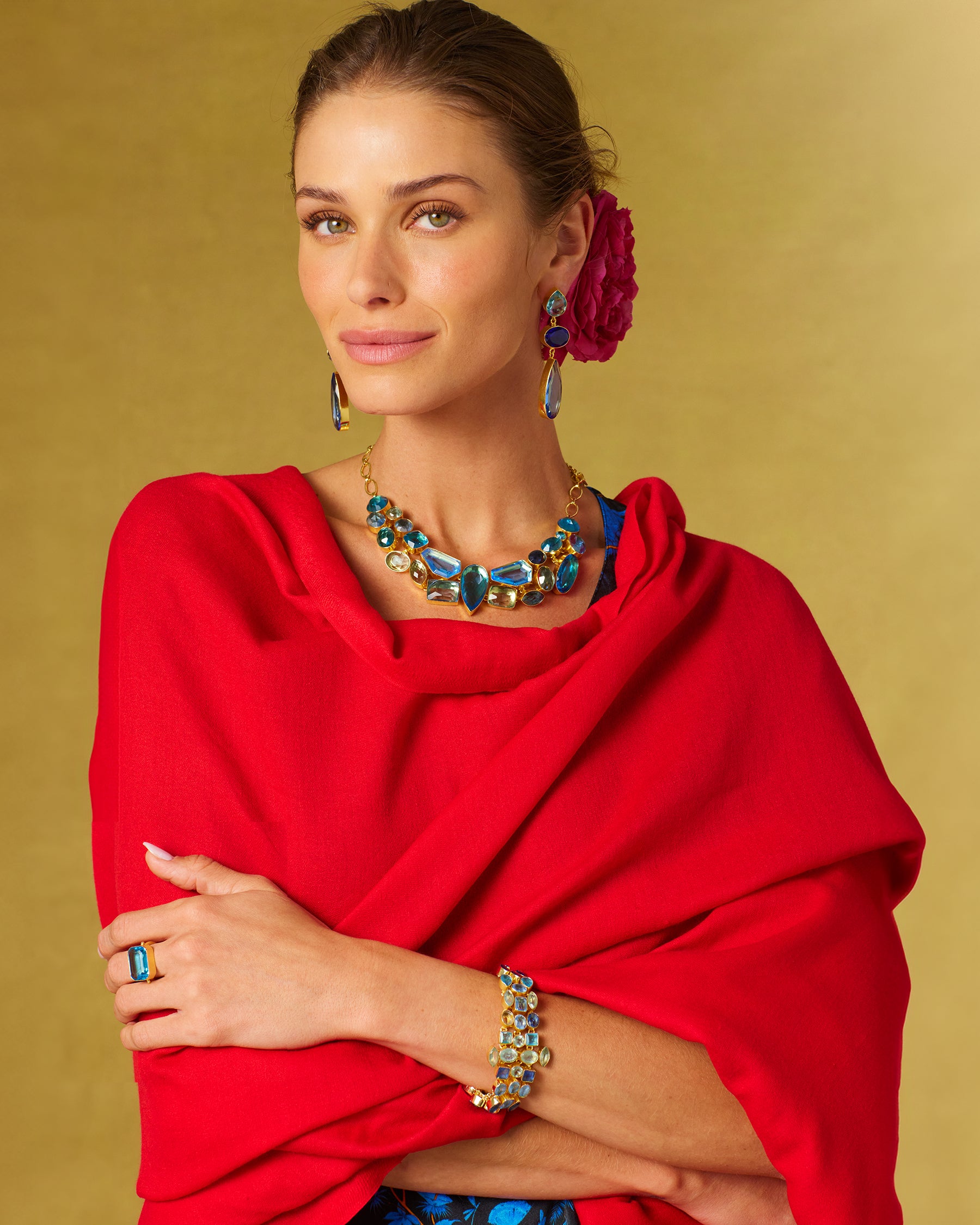 Constance Jewel Encrusted Necklace in Byzantine Sea Blues worn with the matching necklace and the Josephine Pashmina Shawl in Red