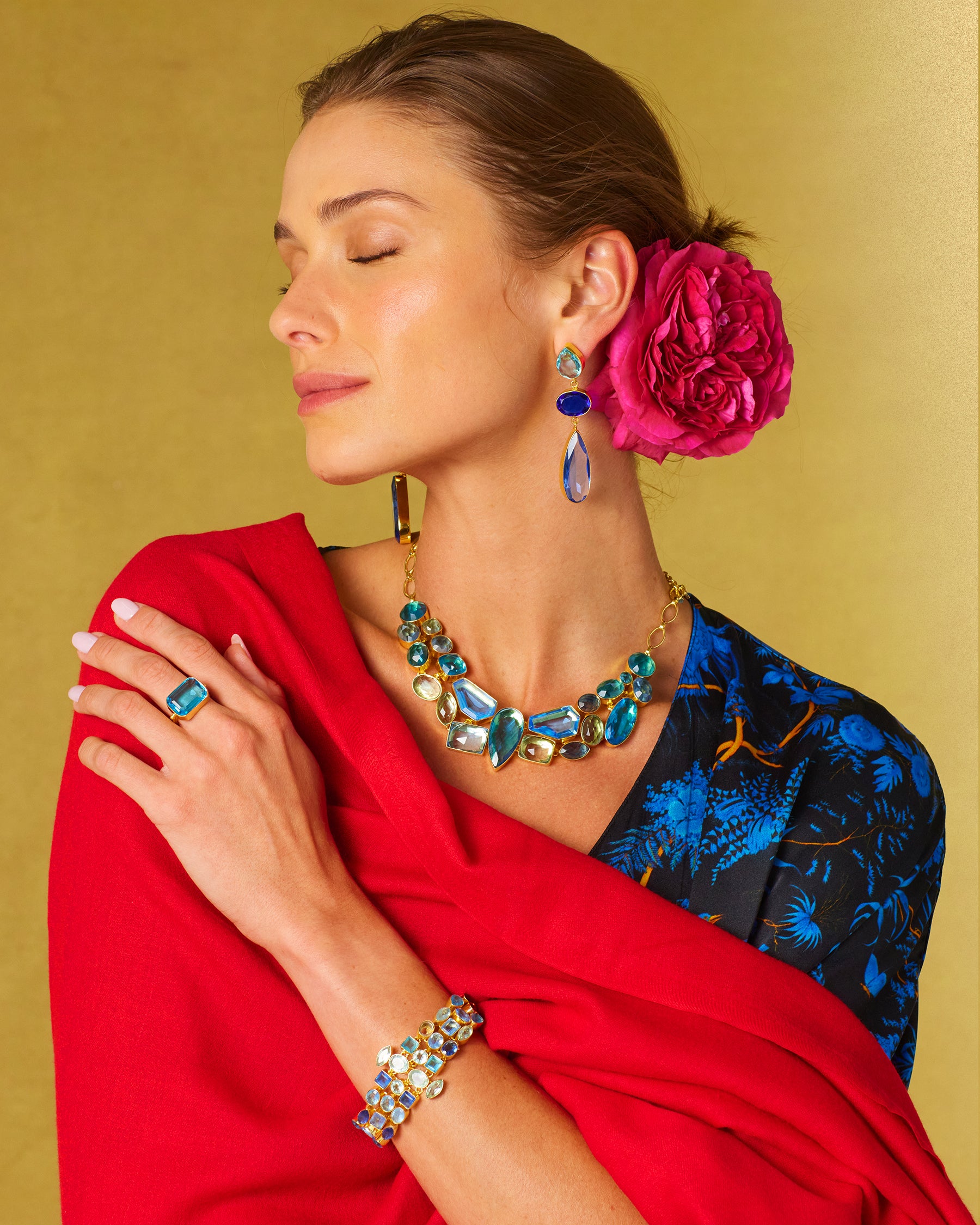 Constance Jewel Encrusted Bracelet in Byzantine Sea Blues worn with the matching necklace and the Regan Silk Kaftan in Midnight Garden and Pashmina Red Shawl