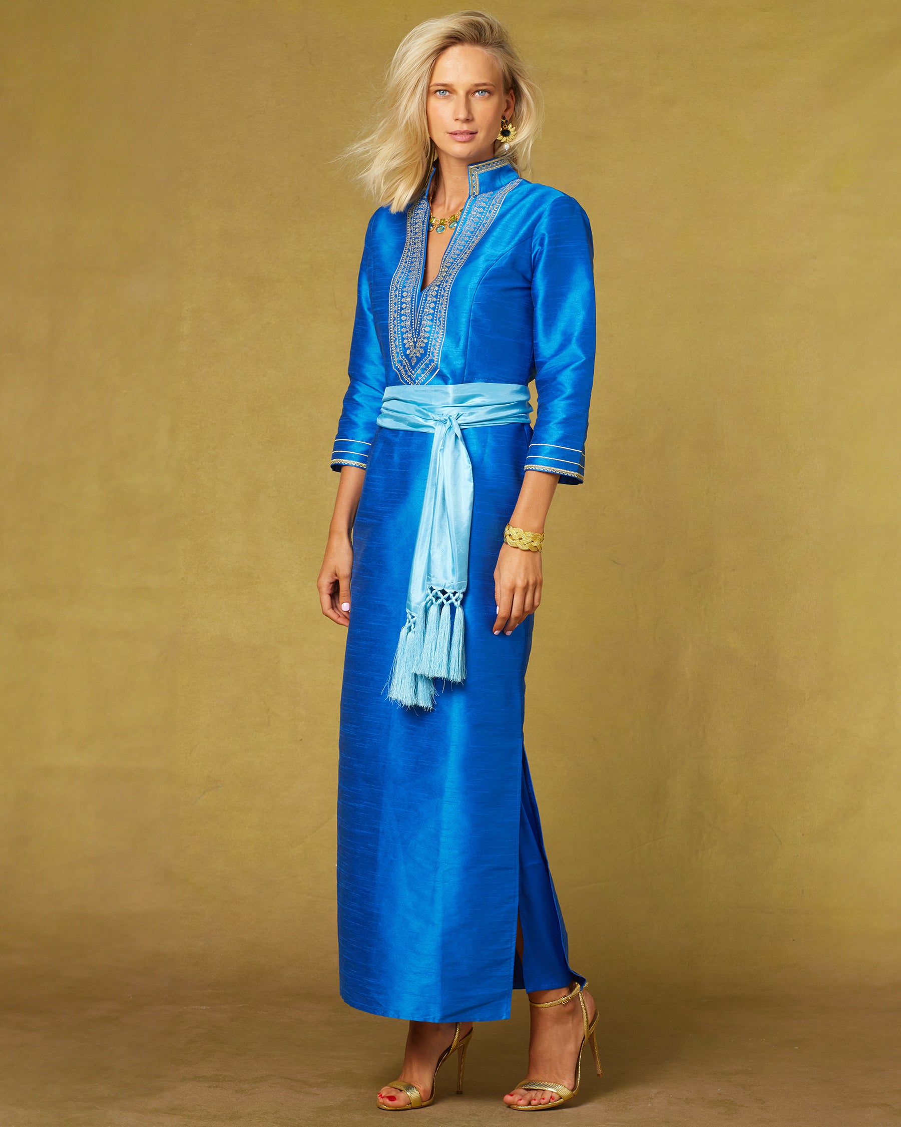 Regine Long Tunic Dress in Royal Blue and Gold Embroidery with the waist cinched with the Cosima Turquoise Sash Belt-Side View