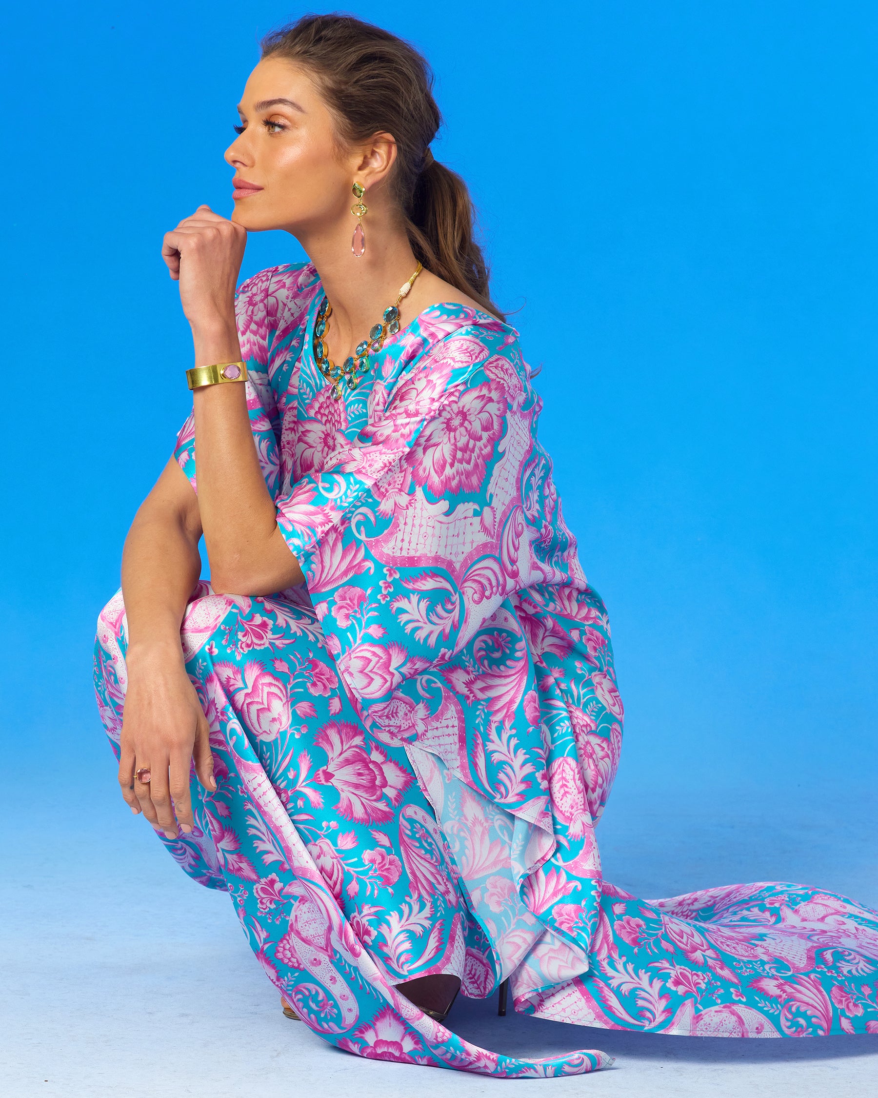 Shalimar Silk Kaftan in Pink and Blue-crouching and looking away