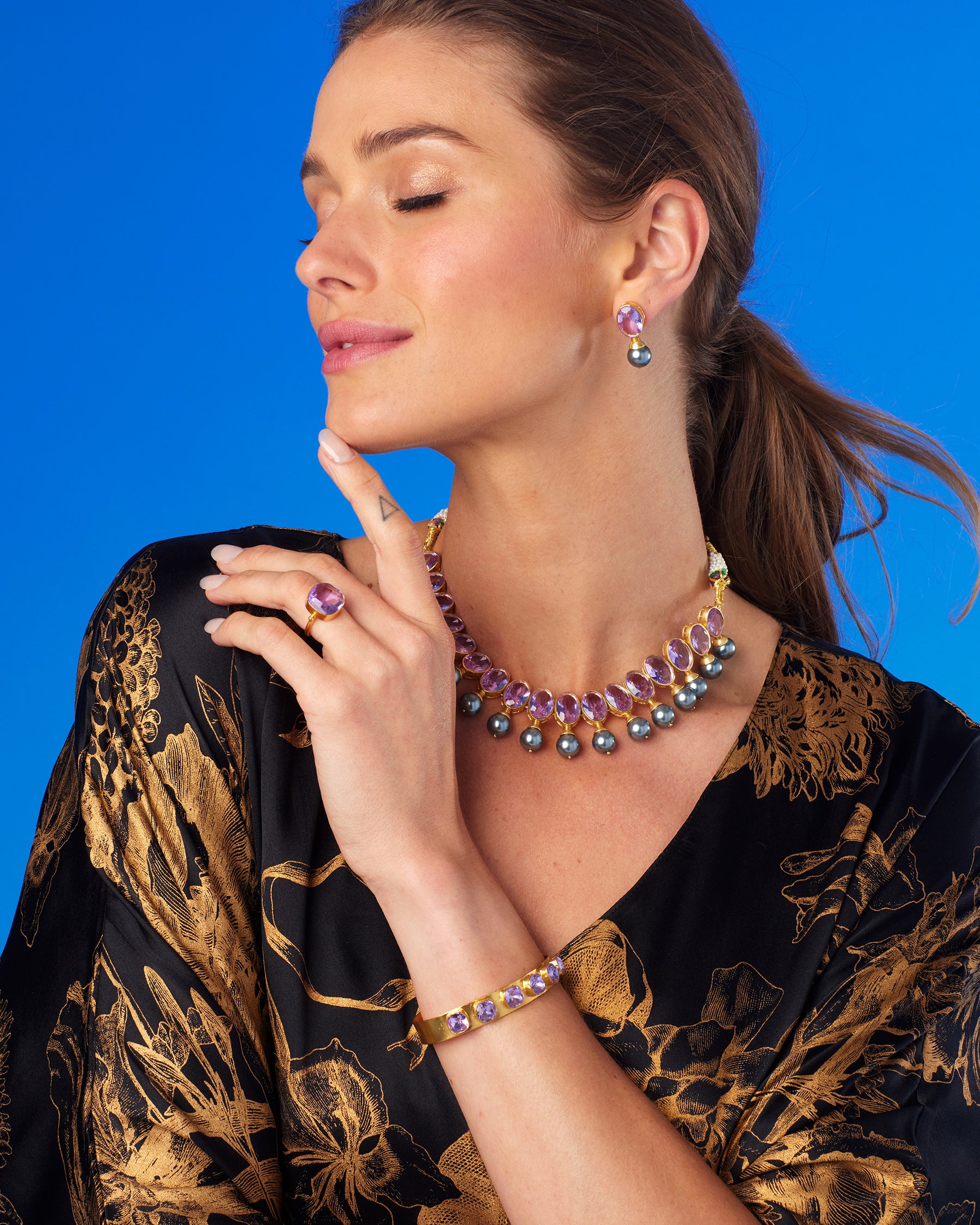 Darby Ring in Amethyst Lavender-Wearing the Shireen Kaftan in Gold Foil