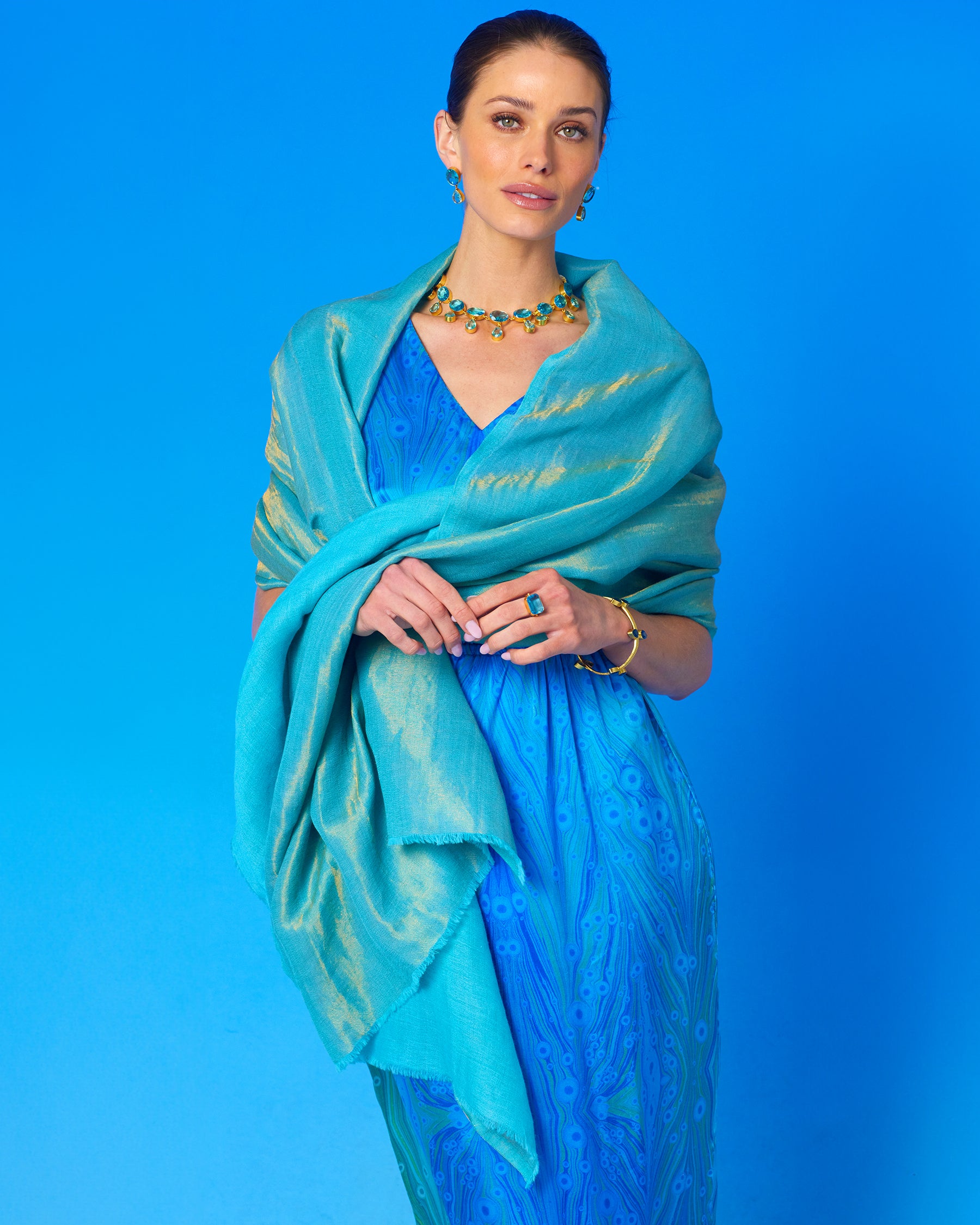 Josephine Reversible Pashmina Shawl in Gold Shimmer Turquoise worn with the Calliope Long Silk Dress