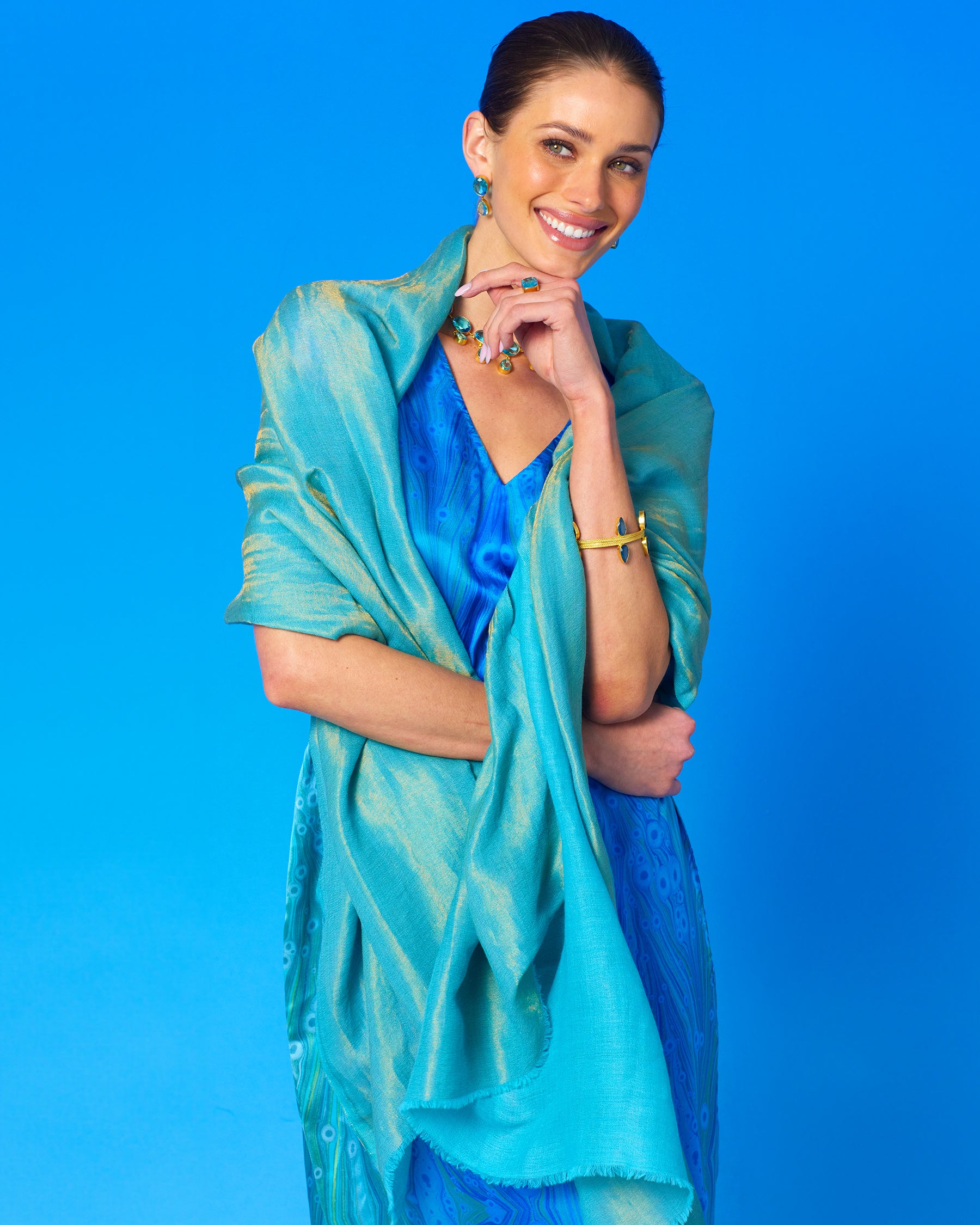 Josephine Reversible Pashmina Shawl in Gold Shimmer Turquoise worn with the Calliope Long Silk Dress