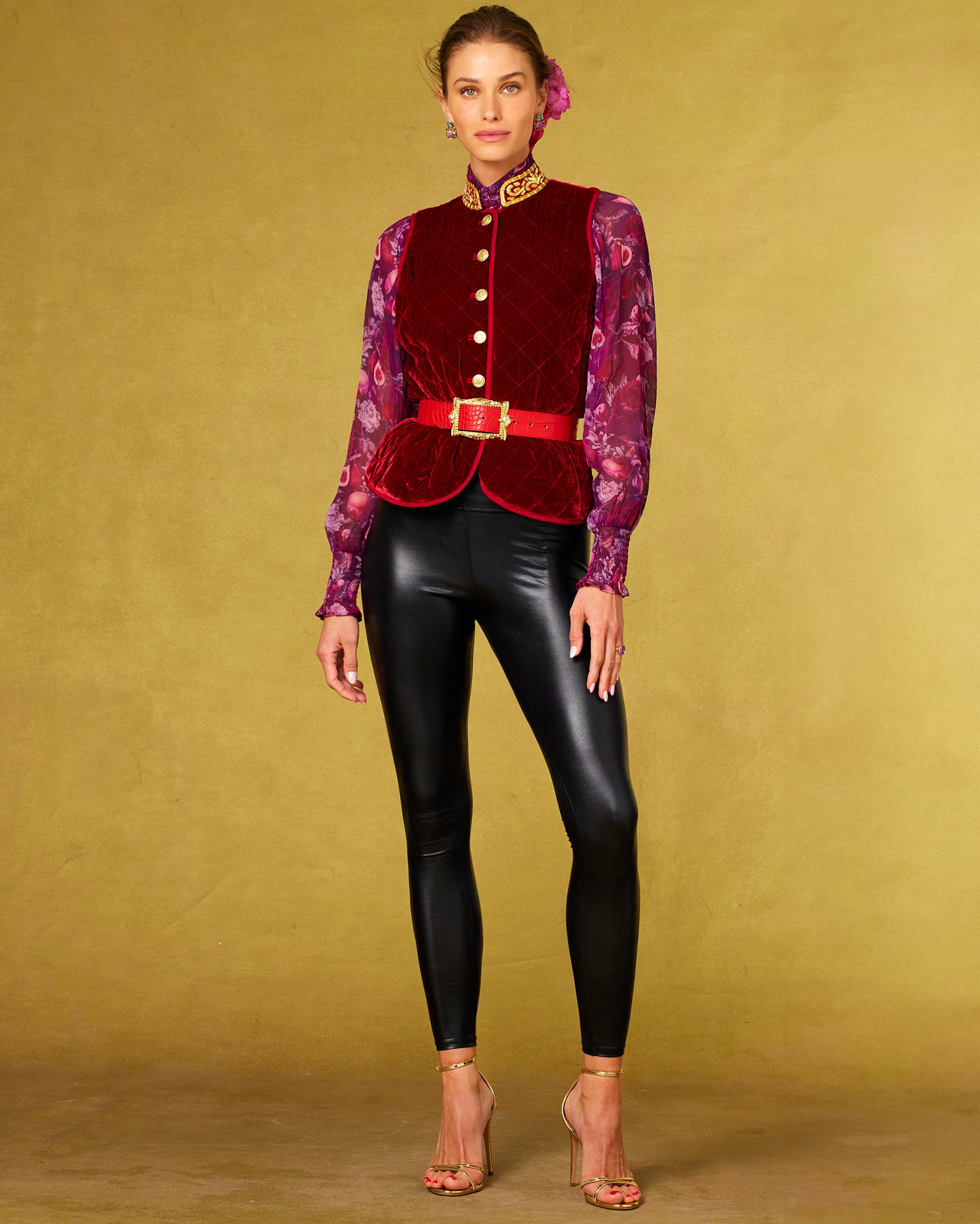 Front view of the Roxana Lacquer Black Leggings worn with the Bentley Quilted Vest in Crimson Red Silk Blend Velvet and Gold Embellishment and Tess Crinkle Chiffon Blouse in Opulent Harvest