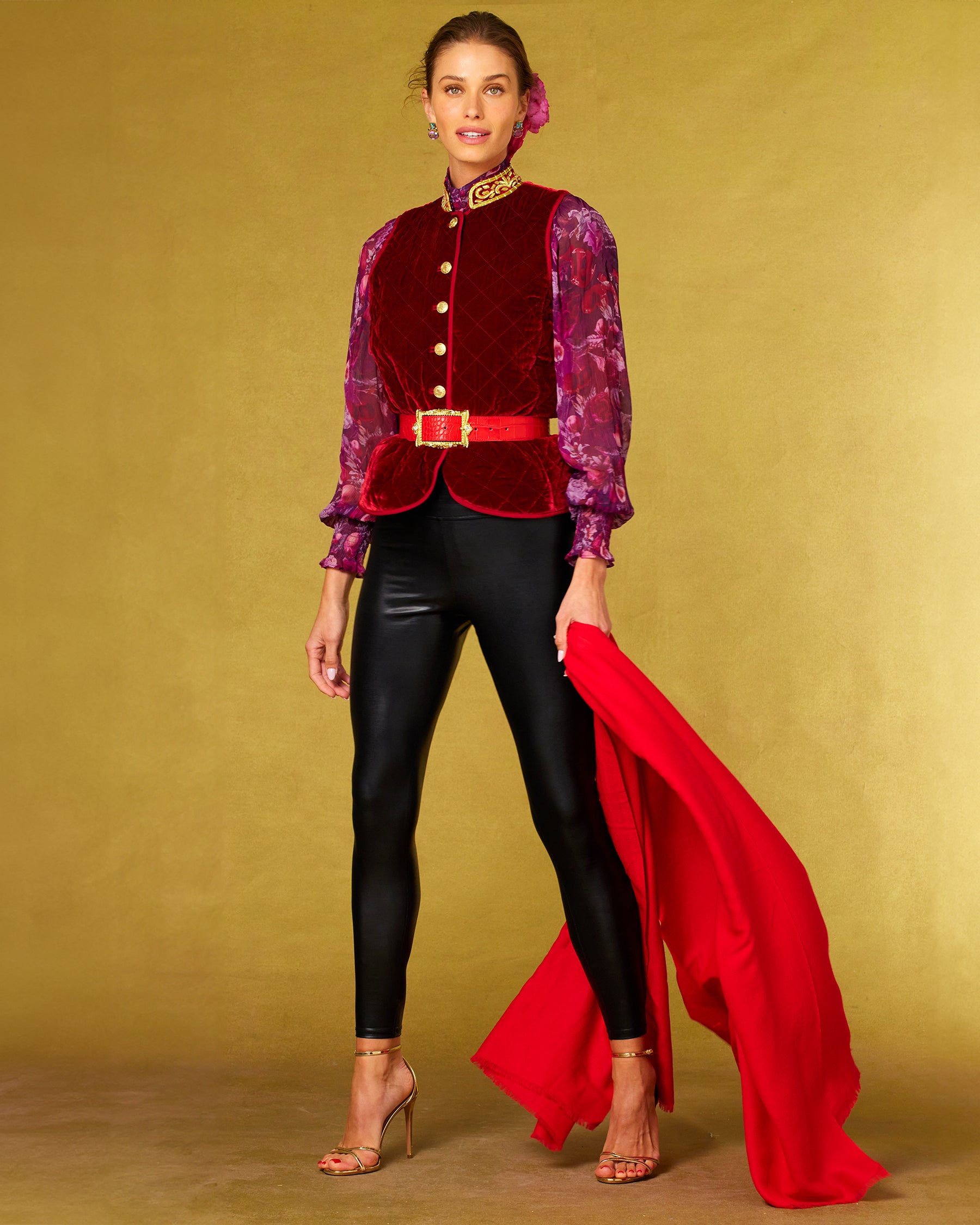 Front view of the Roxana Lacquer Black Leggings worn with the Bentley Quilted Vest in Crimson Red Silk Blend Velvet and Gold Embellishment and Tess Crinkle Chiffon Blouse in Opulent Harvest