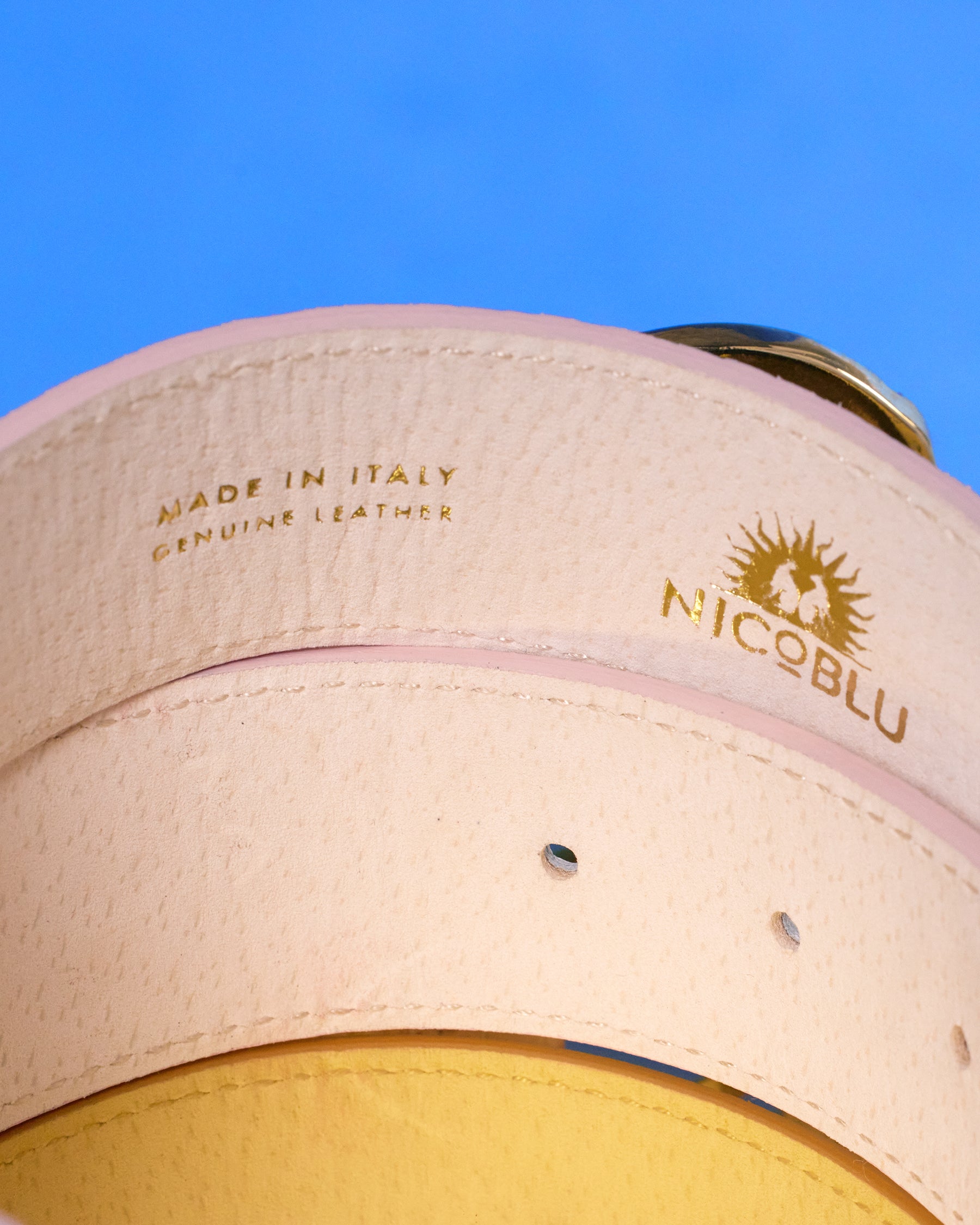 Gold embossed logo on the inside of the Tinsley Leather Belt in Croc-Embossed Blush Pink