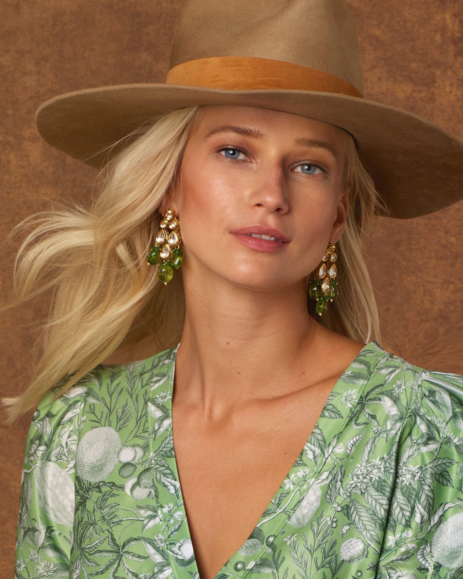 Sharawar Earrings in Peridot Green-Worn with Midi Wrap Dress and Hat