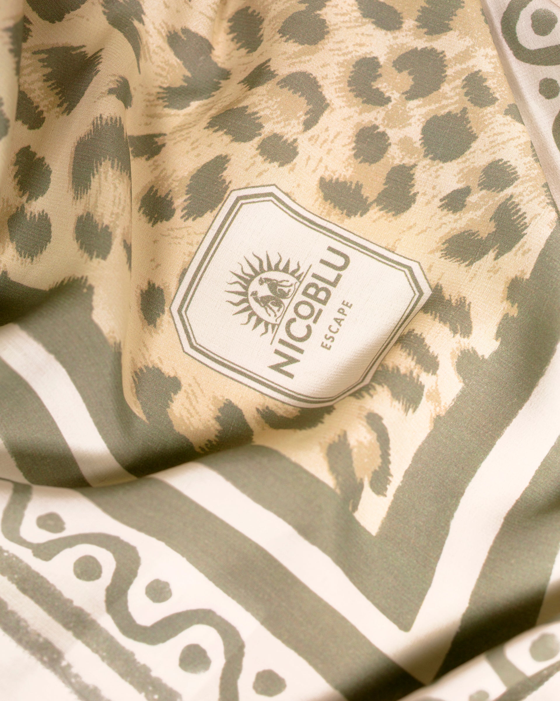 Alannah Pareo in Faded Leopard Print-NicoBlu Logo Detail