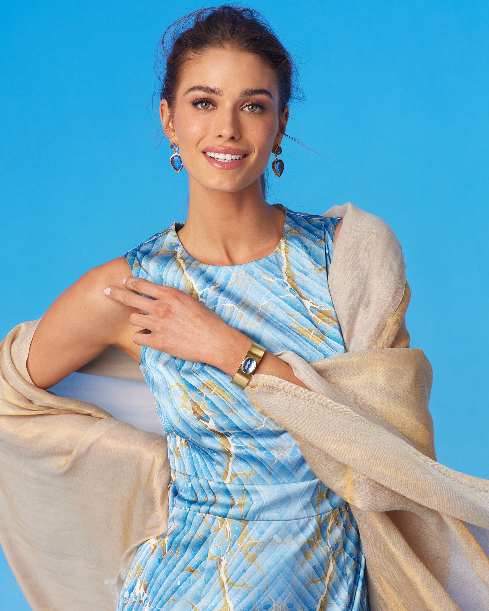 Josephine Reversible Pashmina Shawl in Gold Shimmer Dune-Wearing the Astrid Sheath Dress in Marble Print