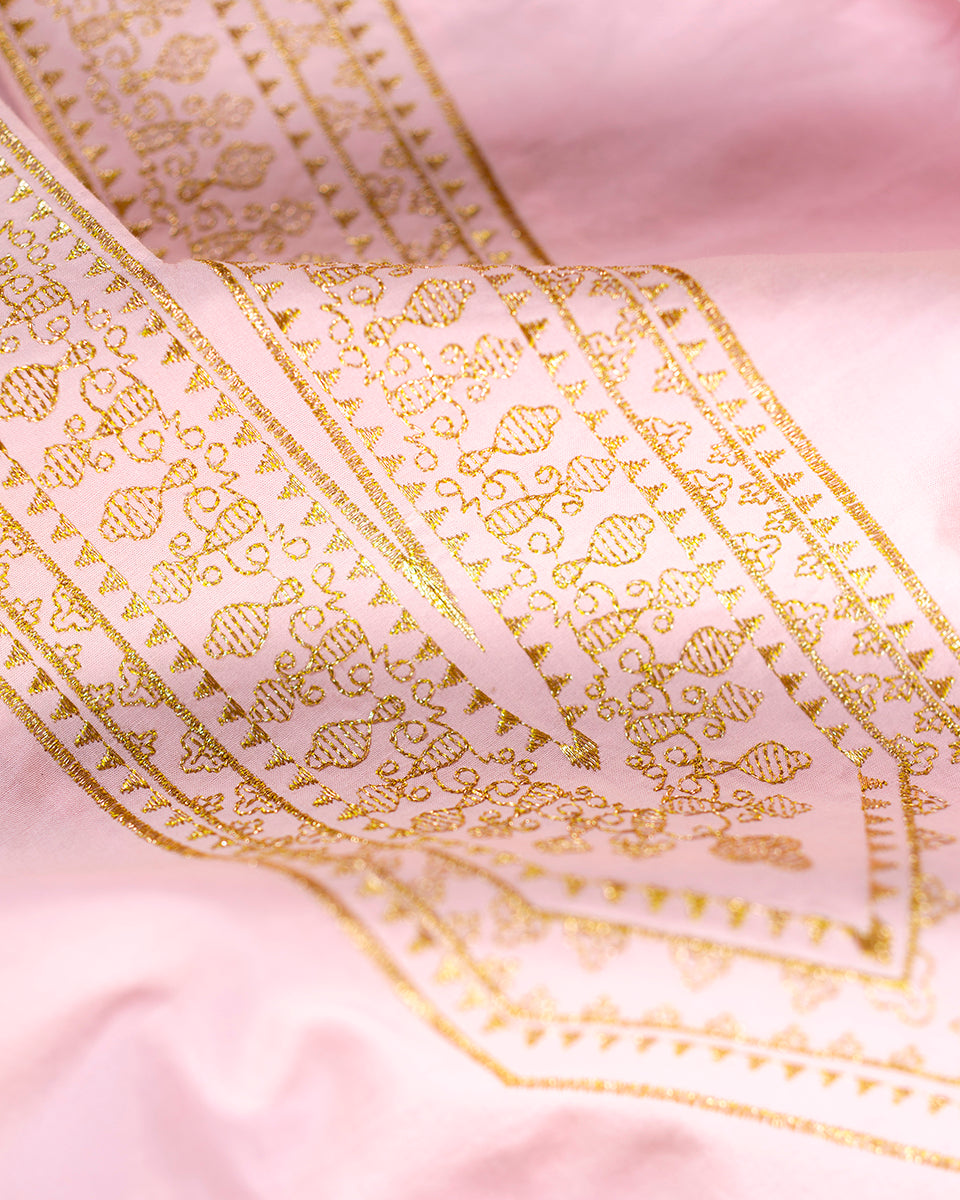 Closeup of exquisite craftsmanship in the embroidery of a gold filiree pattern