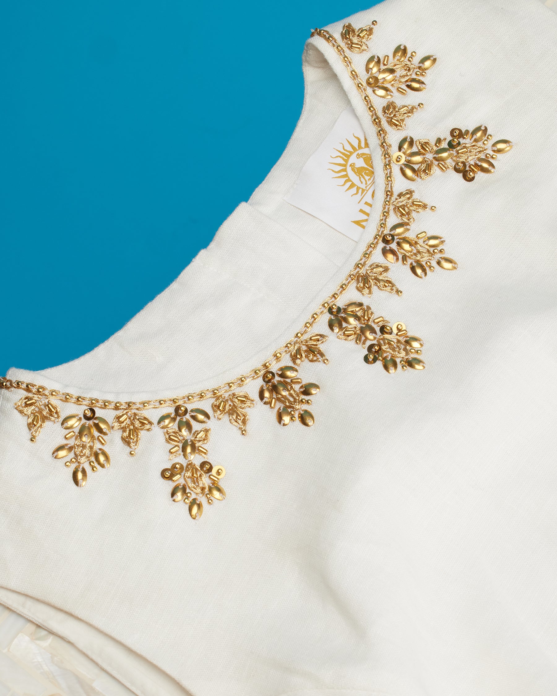 Helena Sleeveless Sheath Dress in Soft White Linen-Detail of Gold Embellishment