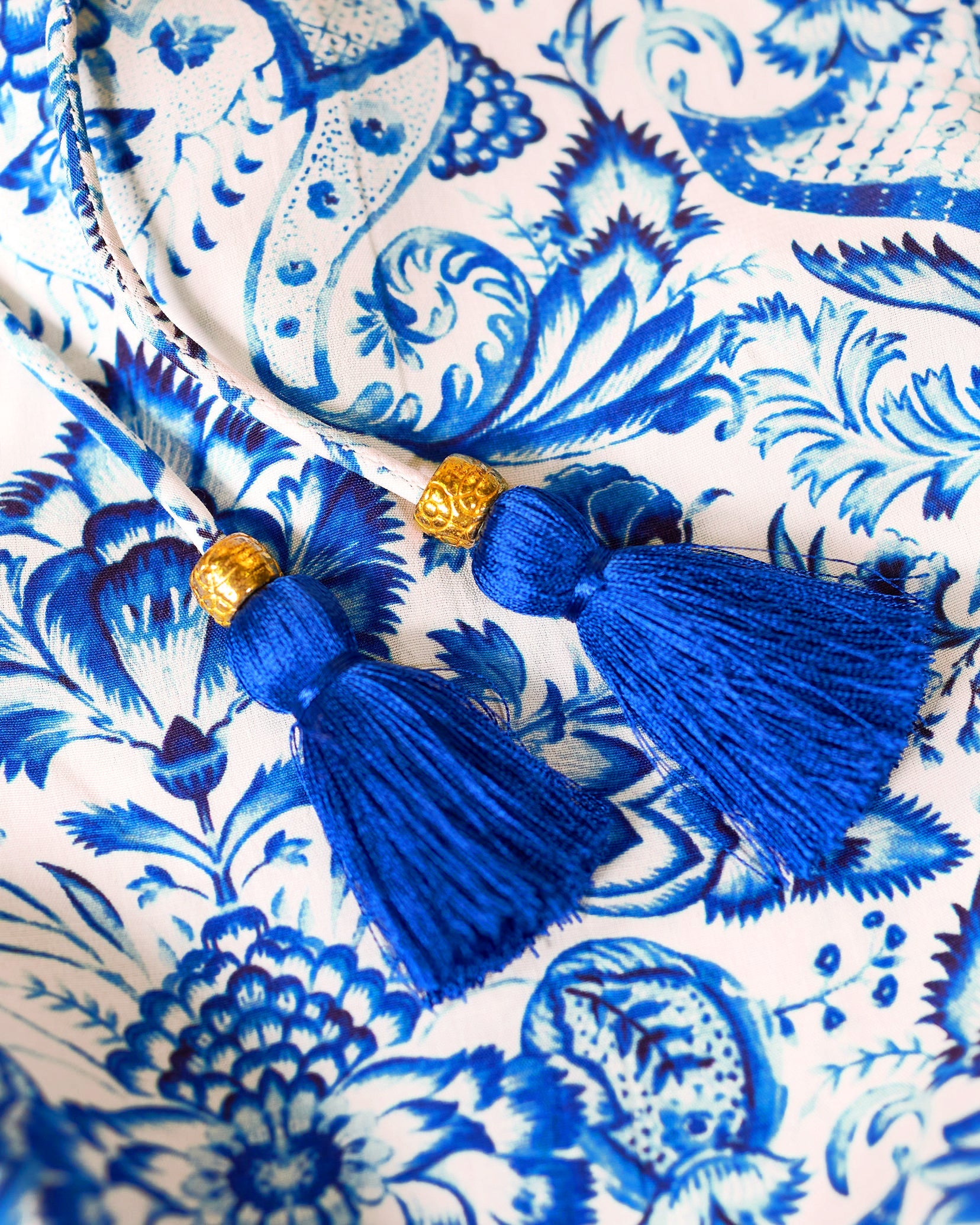 Shalimar Long Bohemian Ruffle Dress in Blue and White-Detail of Tassels